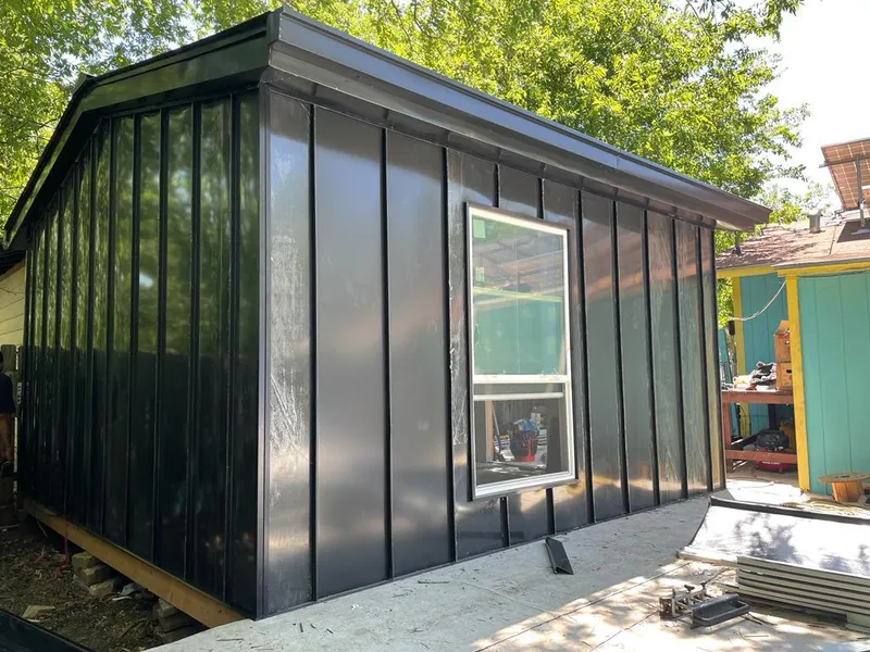 Black standing seam metal wall panels for Roof Inspection in Guttenberg